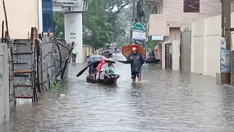 সড়কপথে নৌকায় চলাচল করতে হচ্ছে কর্মজীবিদের